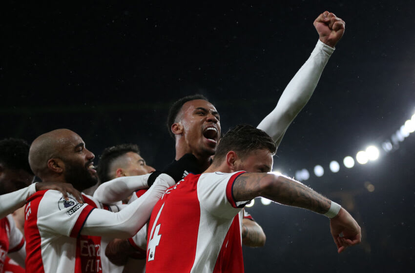 Arsenal's Brazilian defender Gabriel (C) celebrates with teammates after scoring their third goal during the English Premier League football match between Arsenal and Southampton at the Emirates Stadium in London on December 11, 2021. - - RESTRICTED TO EDITORIAL USE. No use with unauthorized audio, video, data, fixture lists, club/league logos or 'live' services. Online in-match use limited to 120 images. An additional 40 images may be used in extra time. No video emulation. Social media in-match use limited to 120 images. An additional 40 images may be used in extra time. No use in betting publications, games or single club/league/player publications. (Photo by Steve Bardens / AFP) / RESTRICTED TO EDITORIAL USE. No use with unauthorized audio, video, data, fixture lists, club/league logos or 'live' services. Online in-match use limited to 120 images. An additional 40 images may be used in extra time. No video emulation. Social media in-match use limited to 120 images. An additional 40 images may be used in extra time. No use in betting publications, games or single club/league/player publications. / RESTRICTED TO EDITORIAL USE. No use with unauthorized audio, video, data, fixture lists, club/league logos or 'live' services. Online in-match use limited to 120 images. An additional 40 images may be used in extra time. No video emulation. Social media in-match use limited to 120 images. An additional 40 images may be used in extra time. No use in betting publications, games or single club/league/player publications. (Photo by STEVE BARDENS/AFP via Getty Images)