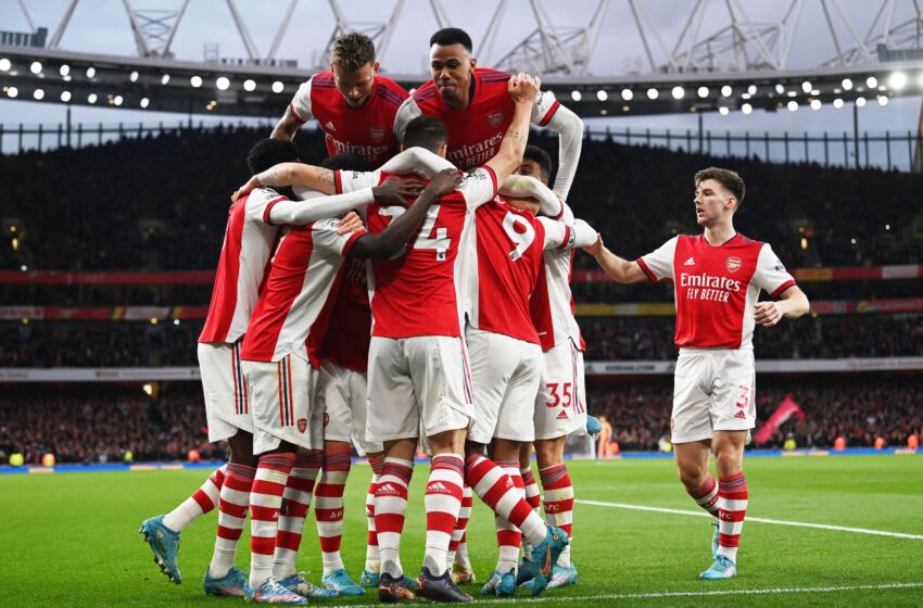 Arsenal players celebrate Arsenal's French striker Alexandre Lacazette scoring their second goal during the English Premier League football match between Arsenal and Leicester City at the Emirates Stadium in London on March 13, 2022. - - RESTRICTED TO EDITORIAL USE. No use with unauthorized audio, video, data, fixture lists, club/league logos or 'live' services. Online in-match use limited to 120 images. An additional 40 images may be used in extra time. No video emulation. Social media in-match use limited to 120 images. An additional 40 images may be used in extra time. No use in betting publications, games or single club/league/player publications. (Photo by Glyn KIRK / AFP) / RESTRICTED TO EDITORIAL USE. No use with unauthorized audio, video, data, fixture lists, club/league logos or 'live' services. Online in-match use limited to 120 images. An additional 40 images may be used in extra time. No video emulation. Social media in-match use limited to 120 images. An additional 40 images may be used in extra time. No use in betting publications, games or single club/league/player publications. / RESTRICTED TO EDITORIAL USE. No use with unauthorized audio, video, data, fixture lists, club/league logos or 'live' services. Online in-match use limited to 120 images. An additional 40 images may be used in extra time. No video emulation. Social media in-match use limited to 120 images. An additional 40 images may be used in extra time. No use in betting publications, games or single club/league/player publications. (Photo by GLYN KIRK/AFP via Getty Images)