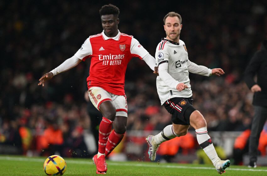 Arsenal's English midfielder Bukayo Saka (L) vies with Manchester United's Danish midfielder Christian Eriksen (R) during the English Premier League football match between Arsenal and Manchester United at the Emirates Stadium in London on January 22, 2023. - - RESTRICTED TO EDITORIAL USE. No use with unauthorized audio, video, data, fixture lists, club/league logos or 'live' services. Online in-match use limited to 120 images. An additional 40 images may be used in extra time. No video emulation. Social media in-match use limited to 120 images. An additional 40 images may be used in extra time. No use in betting publications, games or single club/league/player publications. (Photo by Glyn KIRK / AFP) / RESTRICTED TO EDITORIAL USE. No use with unauthorized audio, video, data, fixture lists, club/league logos or 'live' services. Online in-match use limited to 120 images. An additional 40 images may be used in extra time. No video emulation. Social media in-match use limited to 120 images. An additional 40 images may be used in extra time. No use in betting publications, games or single club/league/player publications. / RESTRICTED TO EDITORIAL USE. No use with unauthorized audio, video, data, fixture lists, club/league logos or 'live' services. Online in-match use limited to 120 images. An additional 40 images may be used in extra time. No video emulation. Social media in-match use limited to 120 images. An additional 40 images may be used in extra time. No use in betting publications, games or single club/league/player publications. (Photo by GLYN KIRK/AFP via Getty Images)