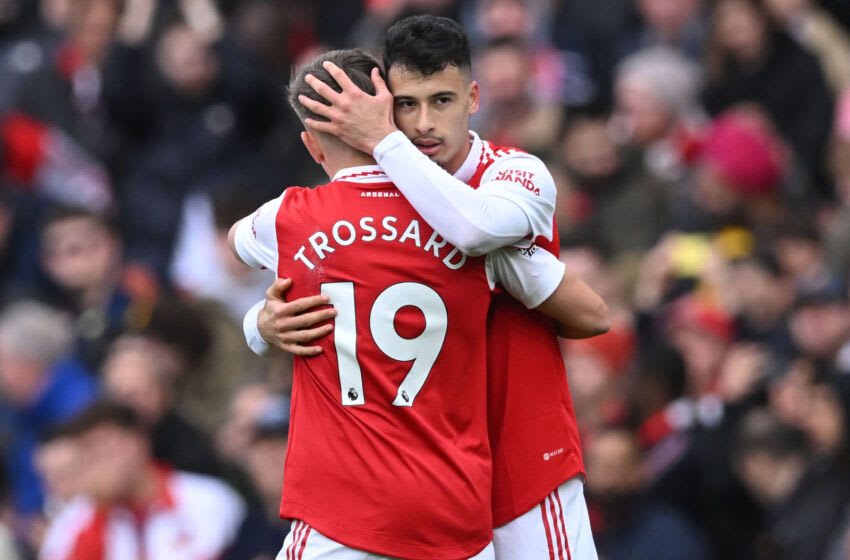 Arsenal's Brazilian midfielder Gabriel Martinelli (R) celebrates with Arsenal's Belgian midfielder Leandro Trossard (L) after scoring the opening goal of the English Premier League football match between Arsenal and Crystal Palace at the Emirates Stadium in London on March 19, 2023. (Photo by JUSTIN TALLIS / AFP) / RESTRICTED TO EDITORIAL USE. No use with unauthorized audio, video, data, fixture lists, club/league logos or 'live' services. Online in-match use limited to 120 images. An additional 40 images may be used in extra time. No video emulation. Social media in-match use limited to 120 images. An additional 40 images may be used in extra time. No use in betting publications, games or single club/league/player publications. / (Photo by JUSTIN TALLIS/AFP via Getty Images)
