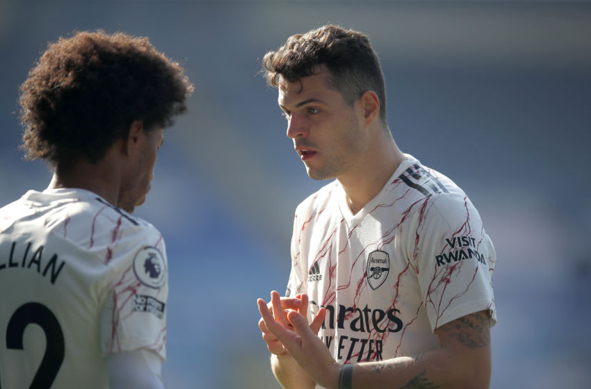 LEICESTER, ENGLAND - FEBRUARY 28: Granit Xhaka of Arsenal (r) talks to Willian during the Premier League match between Leicester City and Arsenal at The King Power Stadium on February 28, 2021 in Leicester, England. Sporting stadiums around the UK remain under strict restrictions due to the Coronavirus Pandemic as Government social distancing laws prohibit fans inside venues resulting in games being played behind closed doors. (Photo by Malcolm Couzens/Getty Images)