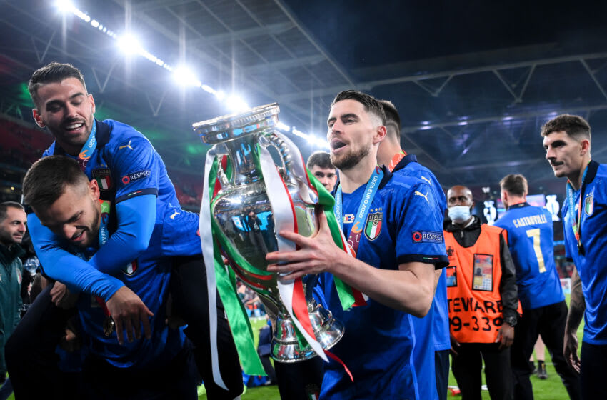 LONDON, ENGLAND - JULY 11: Jorginho of Italy celebrates with The Henri Delaunay Trophy following his team's victory in the UEFA Euro 2020 Championship Final between Italy and England at Wembley Stadium on July 11, 2021 in London, England. (Photo by Laurence Griffiths/Getty Images)