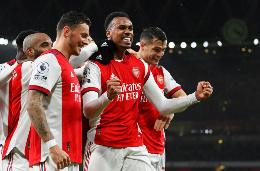 LONDON, ENGLAND - DECEMBER 11: Gabriel Magalhaes of Arsenal celebrates with teammates Ben White and Granit Xhaka after scoring their side's third goal during the Premier League match between Arsenal and Southampton at Emirates Stadium on December 11, 2021 in London, England. (Photo by Justin Setterfield/Getty Images)