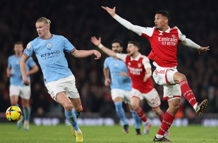 LONDON, ENGLAND - FEBRUARY 15: Erling Haaland of Manchester City moves away from William Saliba of Arsenal during the Premier League match between Arsenal FC and Manchester City at Emirates Stadium on February 15, 2023 in London, England. (Photo by Julian Finney/Getty Images)