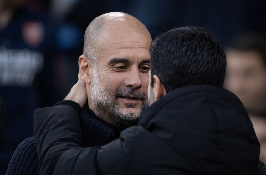 MANCHESTER, ENGLAND - APRIL 26: Manchester City manager Pep Guardiola embraces Arsenal manager Mikel Arteta ahead of the Premier League match between Manchester City and Arsenal FC at Etihad Stadium on April 26, 2023 in Manchester, United Kingdom. (Photo by Joe Prior/Visionhaus via Getty Images)
