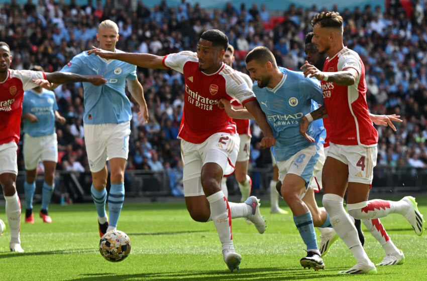 Arsenal's French defender William Saliba (C) defends as Manchester City's Croatian midfielder Mateo Kovacic (2R) runs in on goal during the English FA Community Shield football match between Arsenal and Manchester City at Wembley Stadium, in London, August 6, 2023. (Photo by Glyn KIRK / AFP) / NOT FOR MARKETING OR ADVERTISING USE / RESTRICTED TO EDITORIAL USE (Photo by GLYN KIRK/AFP via Getty Images)