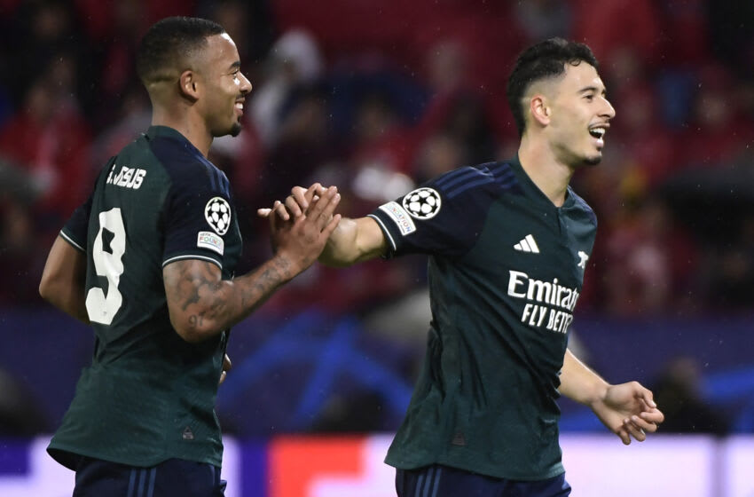Arsenal's Brazilian midfielder #11 Gabriel Martinelli (R) celebrates scoring the opening goal with Arsenal's Brazilian forward #09 Gabriel Jesus during the UEFA Champions League 1st round day 3 Group B football match between Sevilla FC and Arsenal at the Ramon Sanchez Pizjuan stadium in Seville on October 24, 2023. (Photo by CRISTINA QUICLER / AFP) (Photo by CRISTINA QUICLER/AFP via Getty Images)