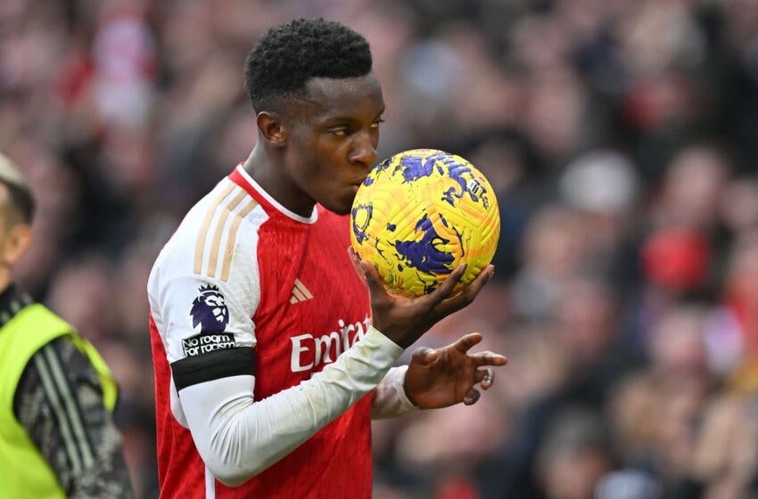 Arsenal's English striker #14 Eddie Nketiah kisses the match ball as he celebrates after scoring his, and their third goal during the English Premier League football match between Arsenal and Sheffield United at the Emirates Stadium in London on October 28, 2023. (Photo by Glyn KIRK / AFP) / RESTRICTED TO EDITORIAL USE. No use with unauthorized audio, video, data, fixture lists, club/league logos or 'live' services. Online in-match use limited to 120 images. An additional 40 images may be used in extra time. No video emulation. Social media in-match use limited to 120 images. An additional 40 images may be used in extra time. No use in betting publications, games or single club/league/player publications. / (Photo by GLYN KIRK/AFP via Getty Images)