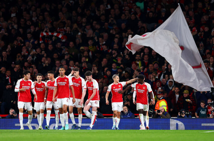 LONDON, ENGLAND - NOVEMBER 08: Leandro Trossard of Arsenal (C) celebrates after scoring the team's first goal with teammate Bukayo Saka (R) during the UEFA Champions League match between Arsenal FC and Sevilla FC at Emirates Stadium on November 08, 2023 in London, England. (Photo by Clive Rose/Getty Images)