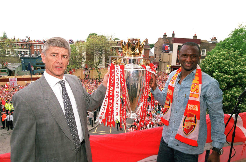LONDON, ENGLAND - MAY 19: Arsenal manager Arsene Wenger and captain Patrick Vieira hold the Premier League trophy at Islington Town Hall on May 19, 2004 in London, England. (Photo by Stuart MacFarlane/Arsenal FC via Getty Images)