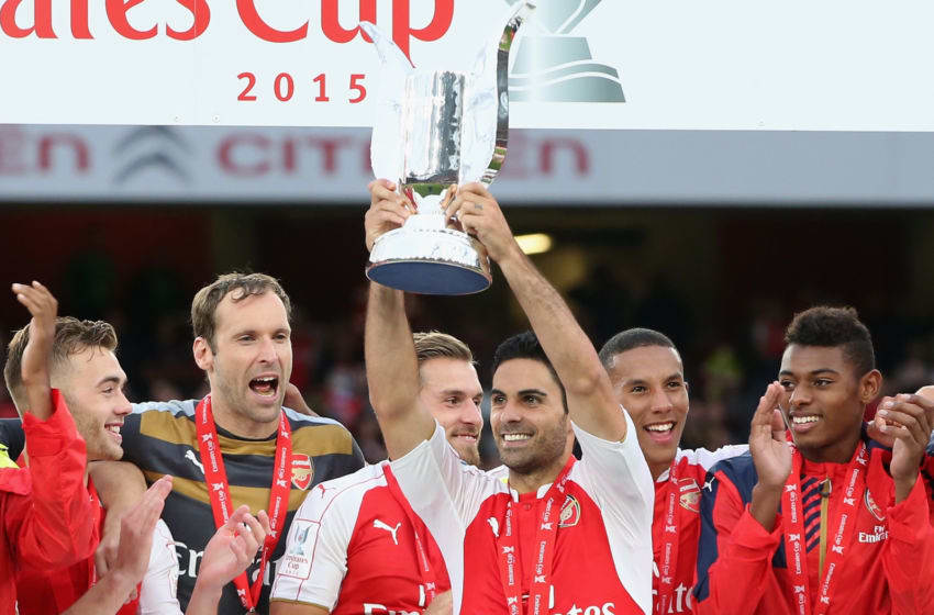 LONDON, ENGLAND - JULY 26: Mikel Arteta, the Arsenal captain raises the trophy after their victory during the Emirates Cup match between Arsenal and VfL Wolfsburg at the Emirates Stadium on July 26, 2015 in London, England. (Photo by David Rogers/Getty Images)