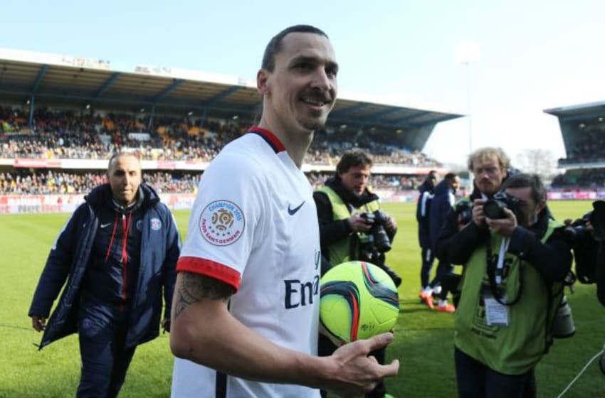 TROYES, FRANCE - MARCH 13: Zlatan Ibrahimovic of PSG keeps the ball of the match because he scored 4 goals while celebrating winning the French League 1 championships 2015-1016 following the French Ligue 1 match between ESTAC Troyes and Paris Saint-Germain (PSG) at Stade de l'Aube on March 13, 2016 in Troyes, France. (Photo by Jean Catuffe/Getty Images)