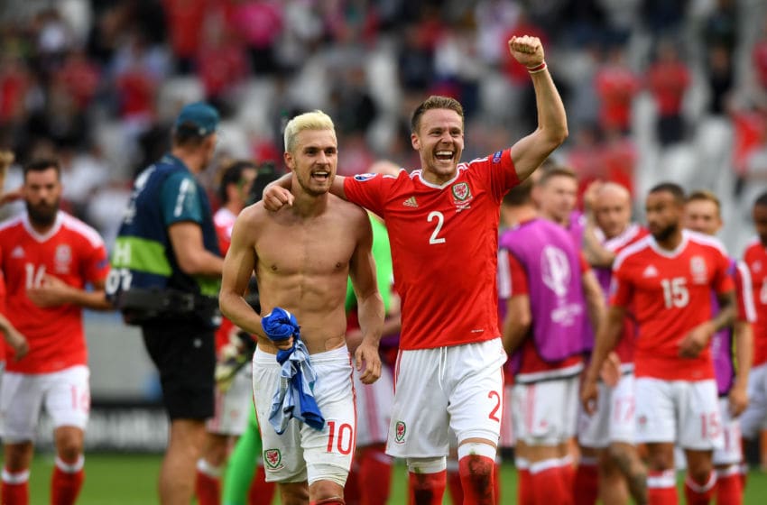 BORDEAUX, FRANCE - JUNE 11: Aaron Ramsey (l) of Wales celebrates his team's win with his team mate Chris Gunter (R) after the UEFA EURO 2016 Group B match between Wales and Slovakia at Stade Matmut Atlantique on June 11, 2016 in Bordeaux, France. (Photo by Stu Forster/Getty Images)